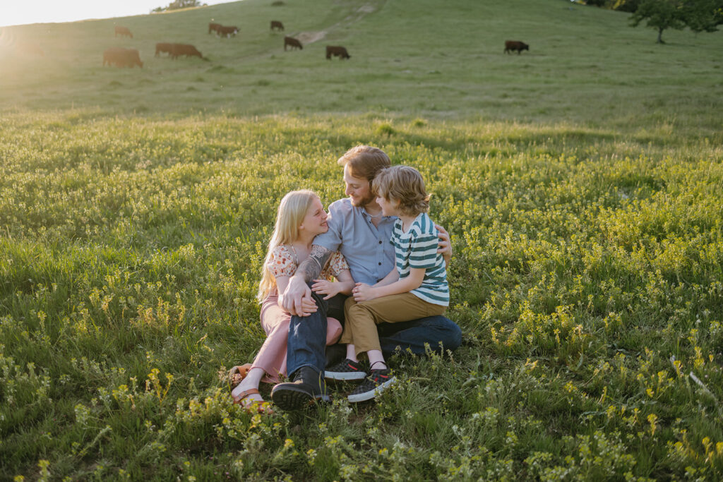 kids playing with dad in an open field