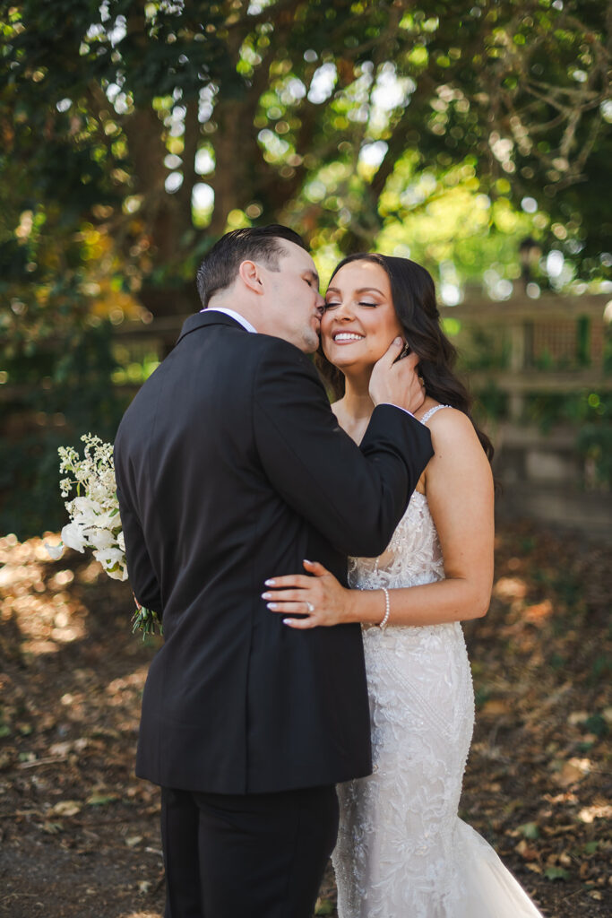 bride and groom kissing during vine hill house wedding