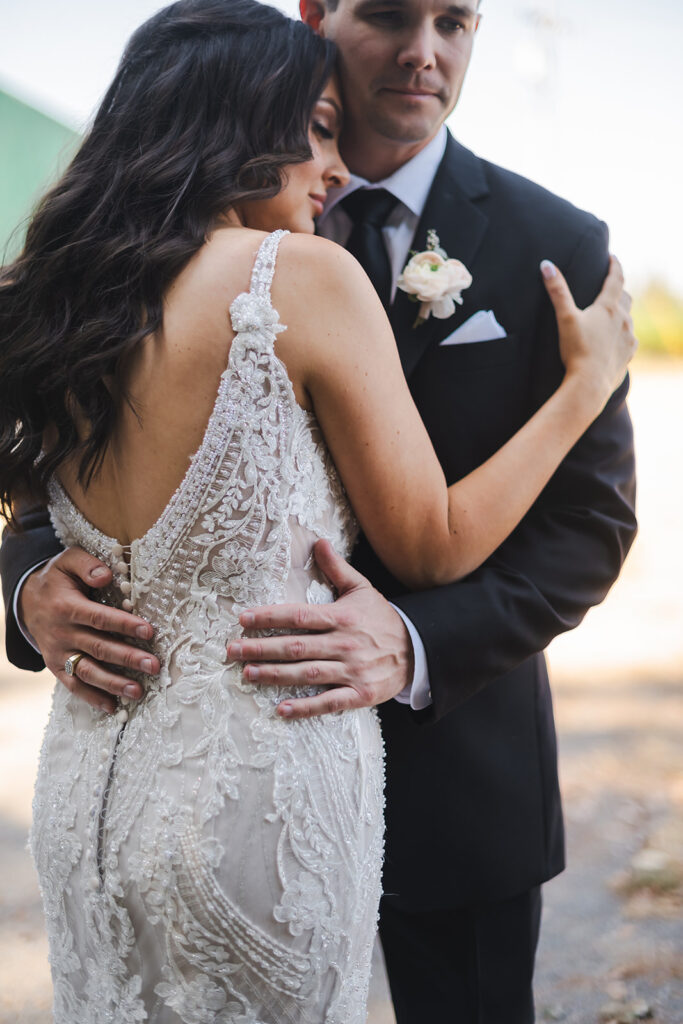 bride and groom holding each other during wedding