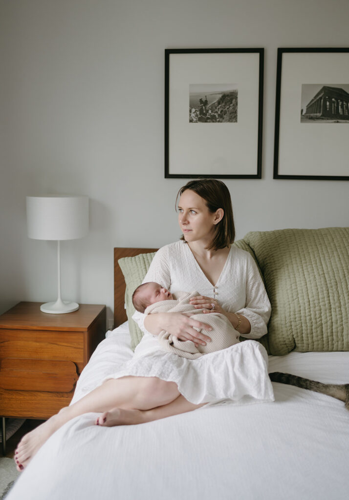 mom holding her baby during their photoshoot