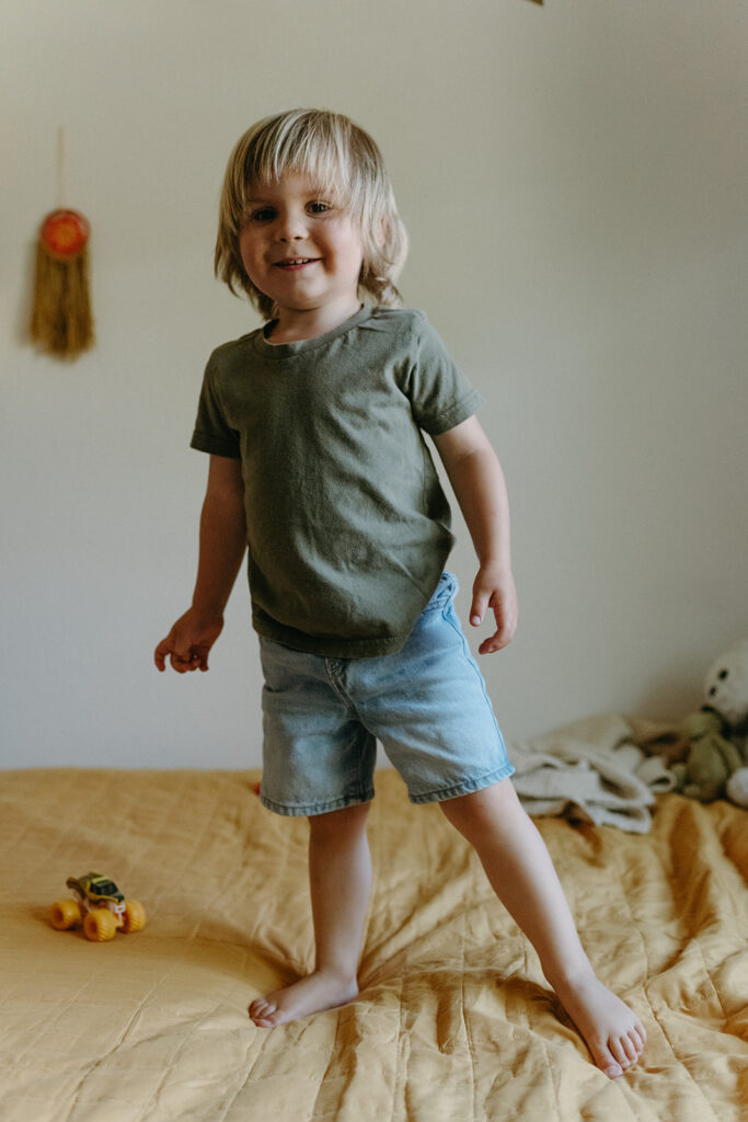 little boy at their Candid In Home Newborn Photography 