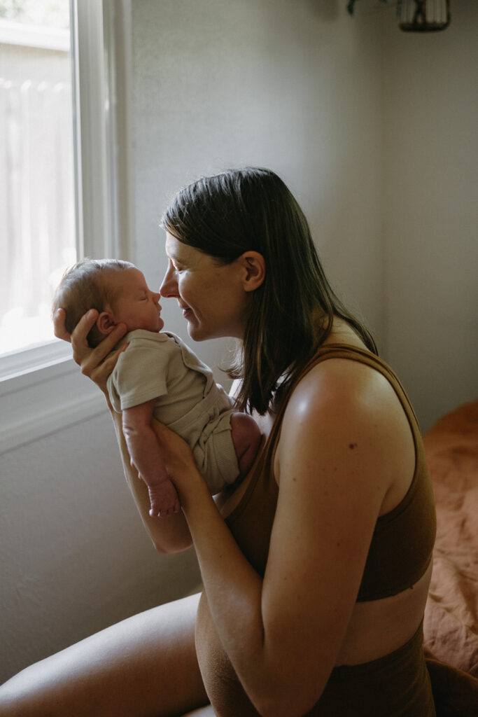 mom looking at her newborn baby