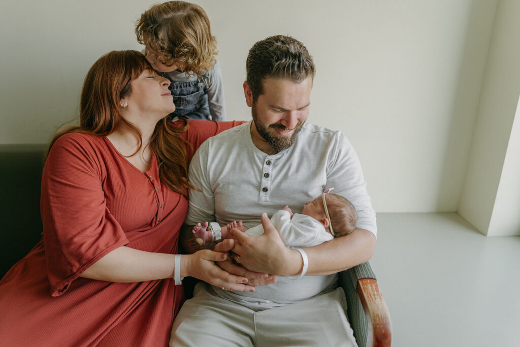 happy family at their newborn session at the hospital 